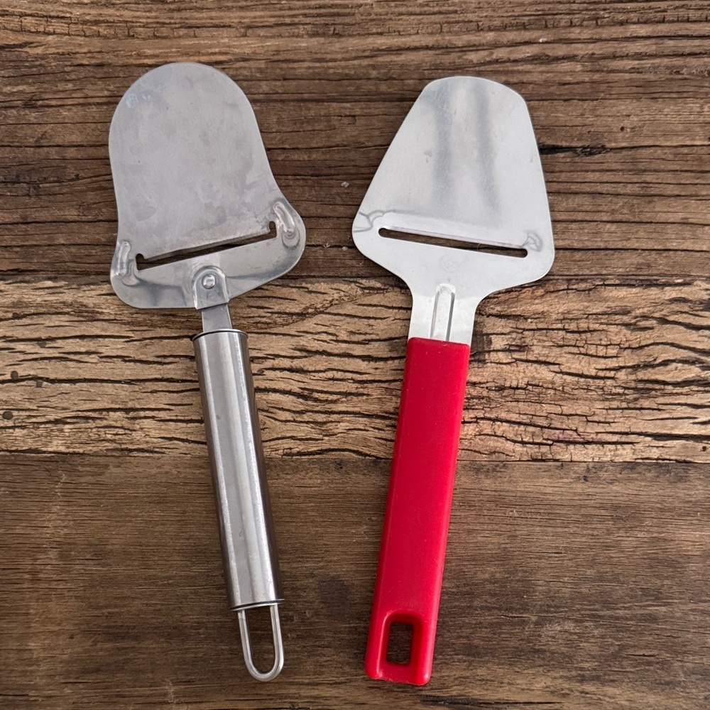 Stainless Steel LEO Cheese Slicer and Karlsson Nilsson Slicer with Red Handle